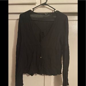 Woman’s black long sleeve blouse